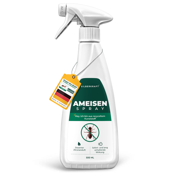 Silberkraft spray na mrówki w białej butelce ze sprayem z zieloną etykietą i symbolem mrówki, z napisem „Spray na mrówki”.
